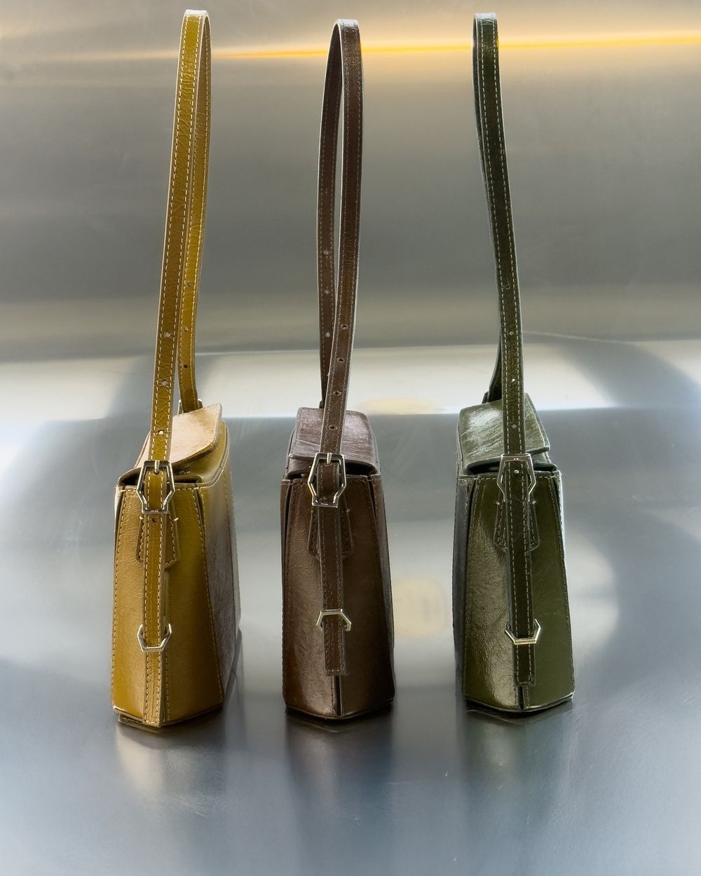 Three small bags made of LUNAFORM™ in olive, brown and green
